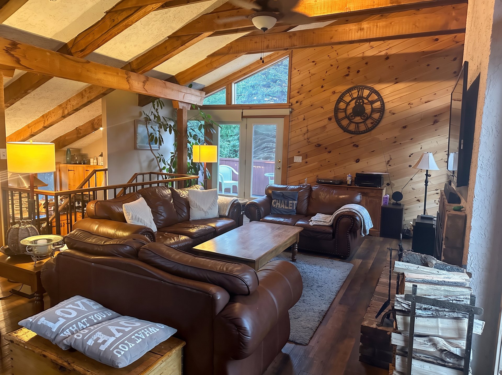 Leather seating and wood-burning fireplace in the living room